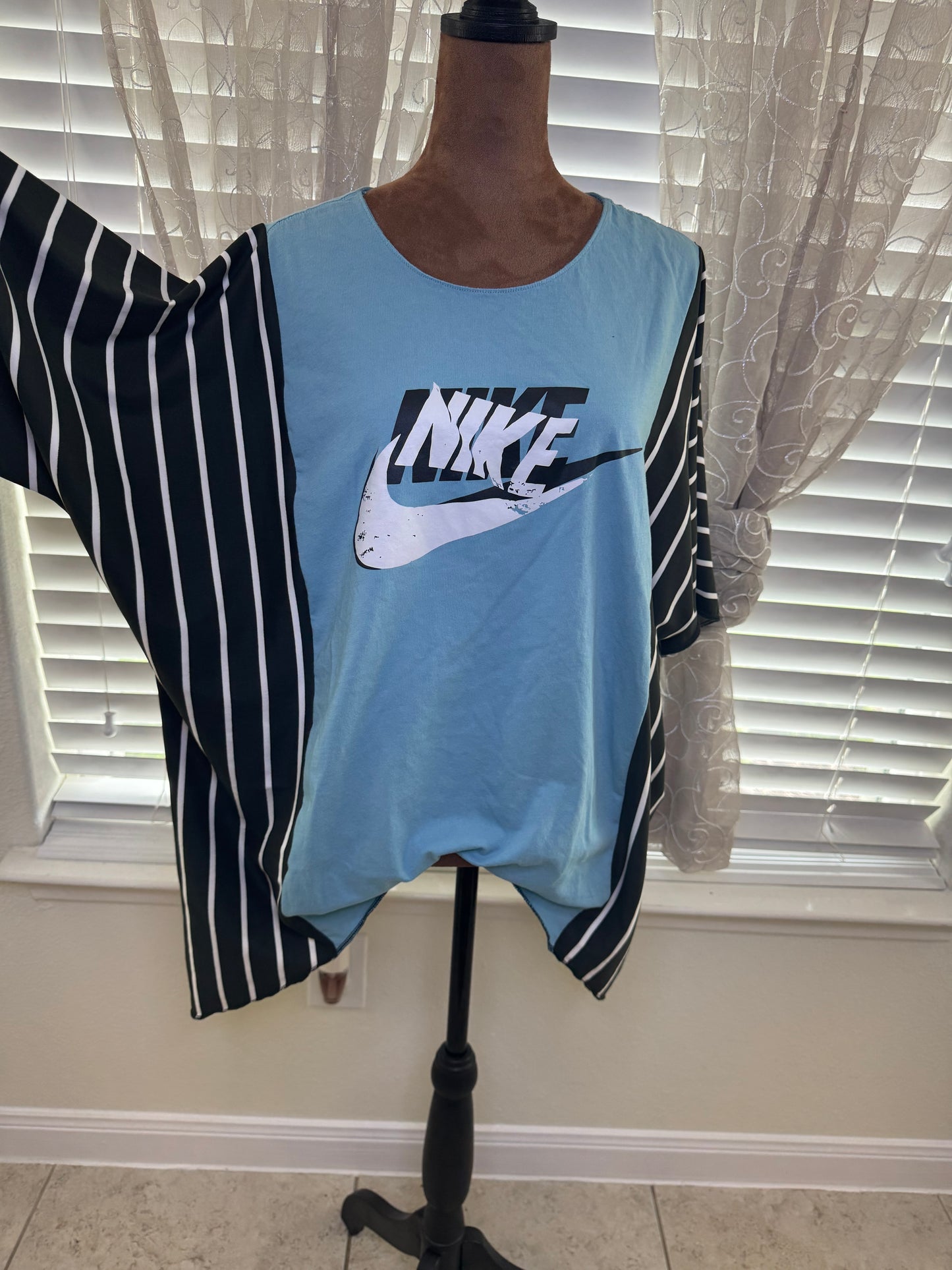 "NIKE" Light Blue T-Shirt with Black/White accents. One Size Fits S-2X