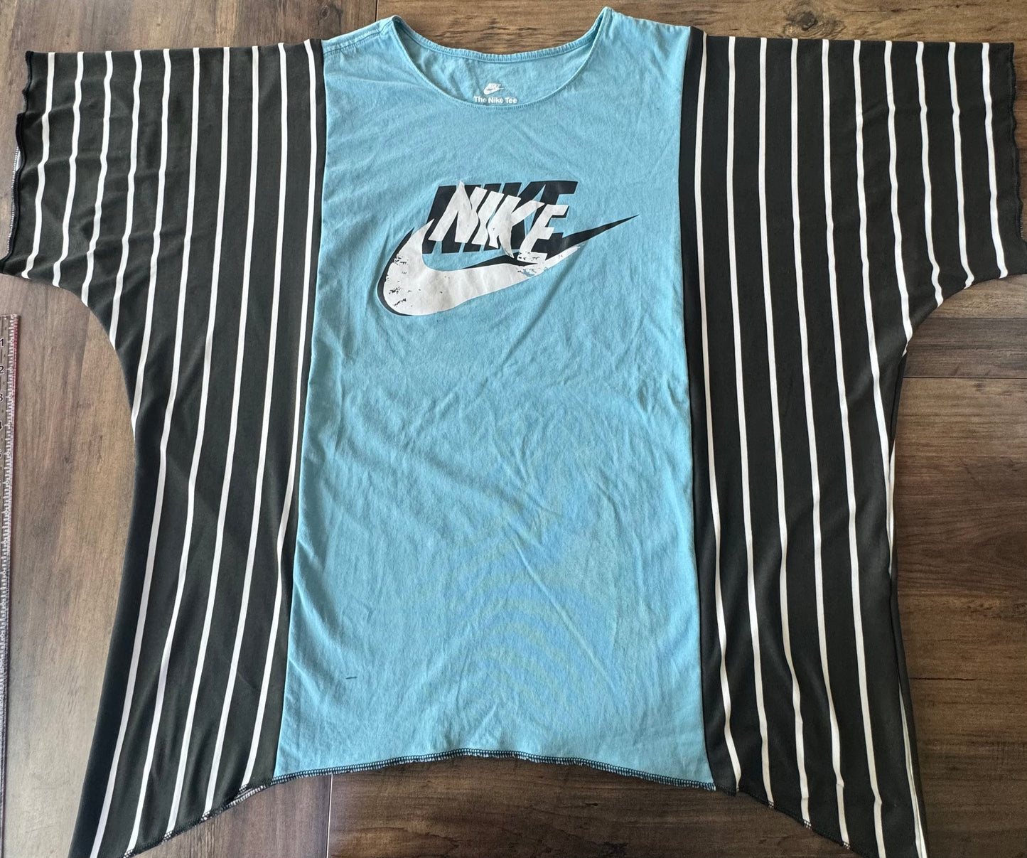 "NIKE" Light Blue T-Shirt with Black/White accents.  One Size Fits S-2X
